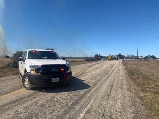 A firefighter was flown to safety after collapsing while responding to a large grass fire off of FM 949 and Pleasant Trails Road. Contributed Photo