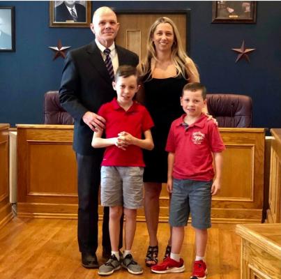 Former Bellville Police Lieutenant Jason Smalley was promoted to Chief of Police and was joined by wife Jenni and sons Caleb and Colt at the March 31 ceremony in the Bellville council chambers. (Contributed photo)