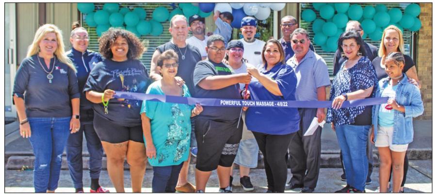 Jen Lopez, with scissors, was surrounded by friends and family in celebrating the ribbon cutting event honoring her membership with the Sealy Chamber of Commerce April 8, outside her shop at 326 North Circle Drive. PHOTOS BY COLE McNANNA