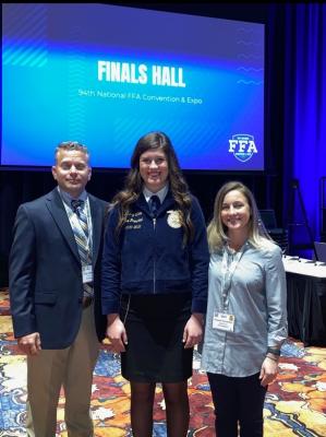 Sealy High School’s Avery Oliver poses with Sealy FFA Advisors Troy Oliver and Angela Snowden at the National FFA Convention in Indianapolis Oct. 29 after her third-place finish. COURTESY PHOTO