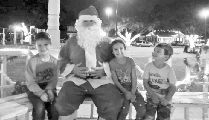 Santa sits with some county children during last year’s event. COURTESY PHOTOS