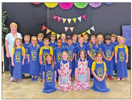 Faith Academy of Bellville first graders recently hosted a Reader’s Restaurant called The Knight’s Café where they read a book with their guest. CONTRIBUTED PHOTO