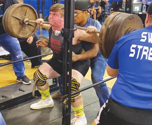 Brazos’ Kasey Zientek executes a squat attempt during the Swamp Strength Invitational at Rice Consolidated High School Jan. 12 in Altair. CONTRIBUTED PHOTO