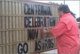 Post Commander Lee Wiley works on the promotional sign outside the Legion Hall for the Centennial Celebration set for Nov. 11-12. PHOTO BY JIMMY GALVAN