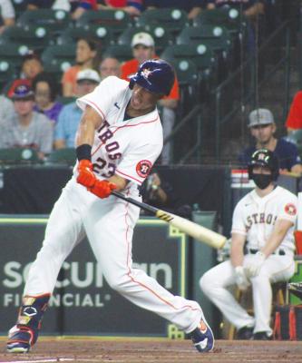 Michael Brantley gets off a swing during the Houston Astros’ contest with the Texas Rangers June 16 at Minute Maid Park. Brantley’s .331 batting average ranked the highest in MLB entering this week. PHOTOS BY COLE McNANNA