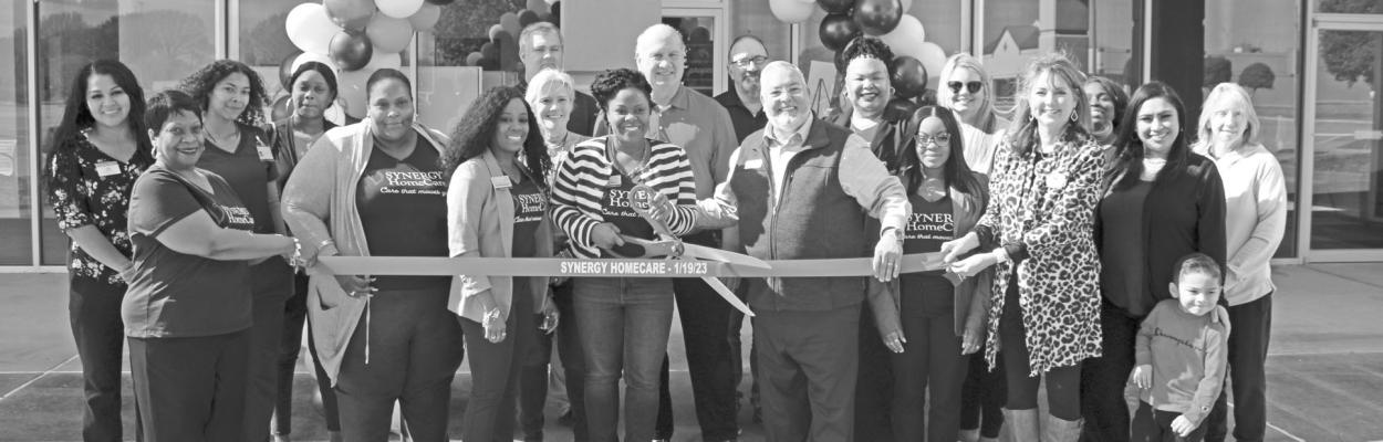 Ribbon cutting for Synergy HomeCare of Sealy was Jan. 19 located at 3701 Outlet Center Drive Suite 90, Sealy. Pictured in center, left to right-Deborah Sanders, owner or Synergy HomeCare and Johnny Bonaccorso, Chamber of Commerce Blue Blazer. PHOTO BY AMANDA LUKSHA