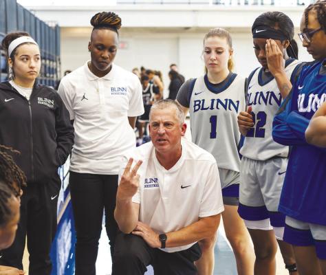 Blinn Wynter Jones goes up for a jump shot in the lane during the victory over Ranger College. Above, Blinn Head Basketball Coach Jeff Jenkins goes over a play during a timeout during the contest. CONTRIBUTED PHOTOS