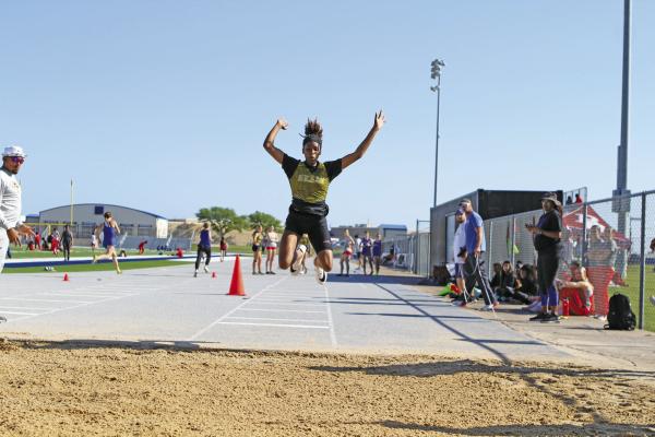 Sealy’s Taniah Coleman sets sail on the triple jump event at the district meet. PHOTOS BY JIMMY GALVAN