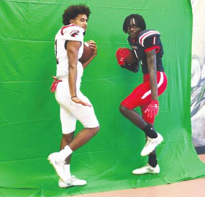 Bryson Bennett (2) and Elijah Johnson (1) show off new uniforms the Brazos Cougars will wear for the 2021 season at a Media Day event last Friday, Aug. 6, at Brazos High School. PHOTOS BY COLE McNANNA
