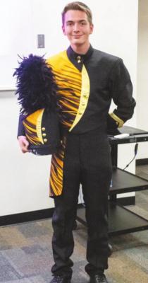 Sealy High School Drum Major Ike Konvicka modeled the proposed new band uniforms presented and approved by the board of trustees.