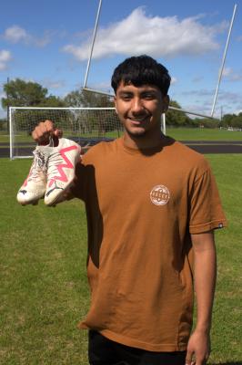 Sealy Tigers Captain Senior Maximino Requena poses in front of the fields he’s been practicing at since a freshman as he reflects on his soccer journey thus far. PHOTO BY ABENEZER YONAS
