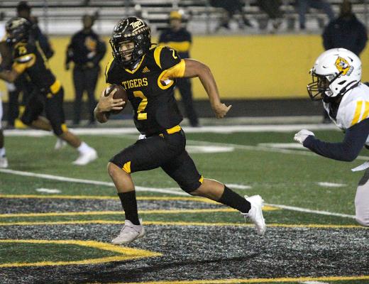 Sealy junior quarterback D’vonne Hmielewski hits the open field en route to his 55-yard touchdown in the first quarter of the Tigers’ regular-season finale against La Marque on Mark A. Chapman Field at T.J. Mills Stadium Friday night. COLE McNANNA