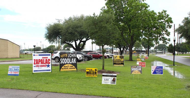 Candidates’ campaign signs littered the front lawn of the Hill Center, a General Election voting location in Sealy, on Saturday’s Election Day. (Cole McNanna/Sealy News)