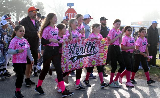 Greater Sealy Little League teams, including Stealth in Minor Girls’ Softball, paraded down Park Street at B&PW Park Saturday morning, March 26, as part of Opening Day festivities. AMANDA LUKSHA