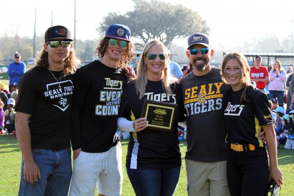 The Grigar family was honored alongside the Kainer family for their contributions to Greater Sealy Little League during Saturday morning’s Opening Day festivities on Mark A. Chapman Field. Pictured from the left are Drake, Gage, Katy, Joel and Avery Grigar. AMANDA LUKSHA