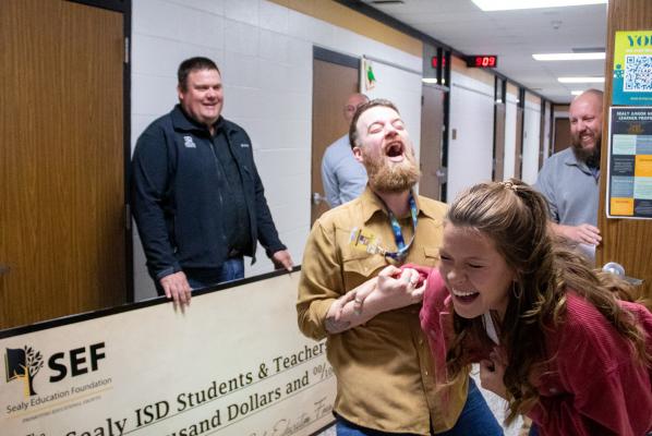 Brackston Nutt and Symantha Krenek celebrate the reception of a $5,000 grant from the Sealy Education Foundation last Thursday to create a multimedia studio at Sealy Junior High called The Tiger Eye. COLE McNANNA
