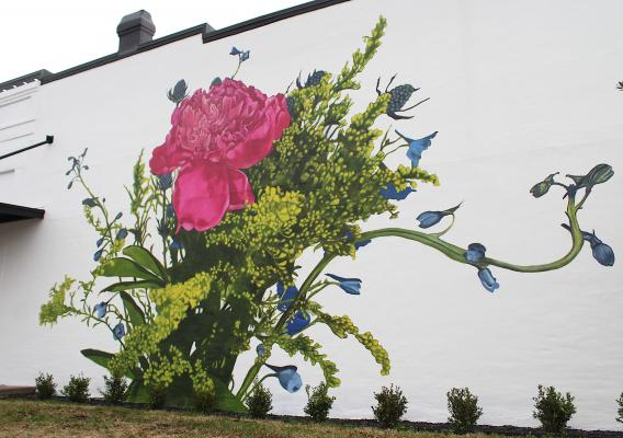 The side of the Edward Jones building on Fowlkes Street in downtown Sealy got a facelift last week when Mel Eason, owner of Joy Brush Designs, completed her mural. (Cole McNanna/Sealy News)