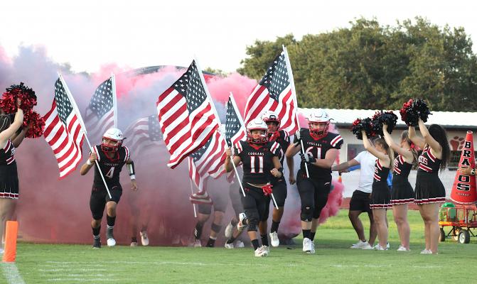 The Brazos Cougars emerged from the tunnel with American flags on the eve of the 20th anniversary of the 9/11 attacks.