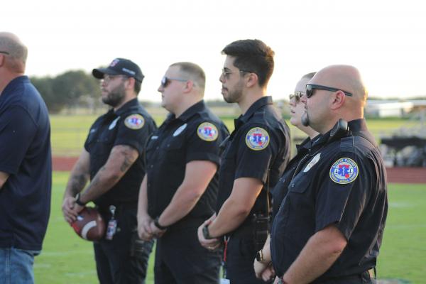 Local first responders joined Brazos Cougar football players at midfield for the coin toss ahead of last Friday’s football game against Burton in Wallis.