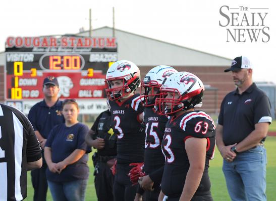 Brazos Cougar football captains Noah Gregory (3), Trey Gaston (25) and Jonoah Fonseca (63) were joined by local first responders for the coin toss before last Friday’s game against Burton on Stars and Stripes night Sept. 10.