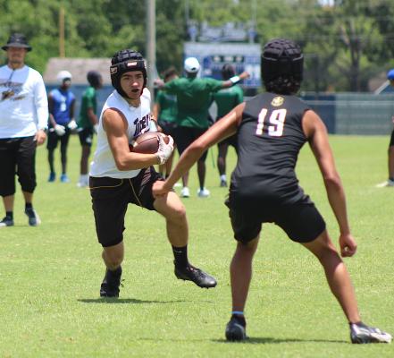 Tiger receiver Bradley Garbs barrels down on a Jordan defender during Sealy’s 7-on-7 exhibition contest June 23 at Taylor High School in Katy. COLE McNANNA
