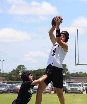 Tiger receiver Reid Miller rises up for a touchdown in Sealy’s 7-on-7 game against Jordan June 23 at Taylor High School. COLE McNANNA