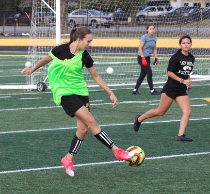 Sealy freshman Lani Krenek sends a ball to the other end during a Dec. 16, 2021, practice at T.J. Mills Stadium. The Lady Tigers opened the regular season with a loss on Monday. COLE McNANNA