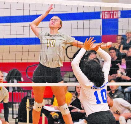 Grace Eschenburg goes up for a kill shot during last Friday’s win over Royal. PHOTO BY JIMMY GALVAN
