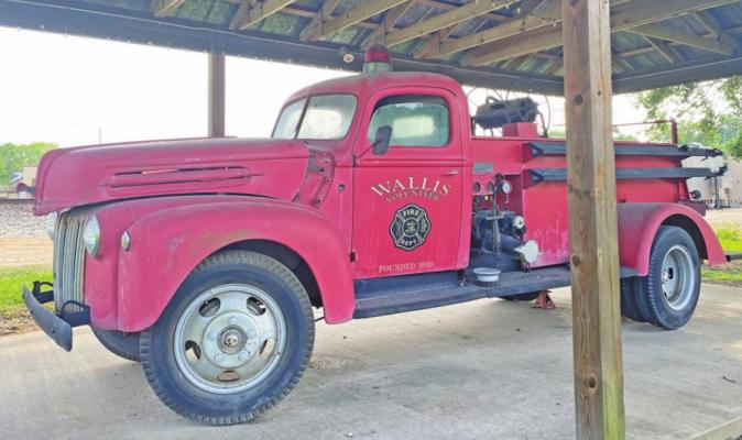 The old-fashioned fire truck, located in Firemans Park in downtown Wallis, is one of the favorite landmarks among city officials and residents. PHOTOS BY RAE DRADY