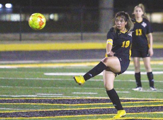 Sealy senior Daniela Acosta clears a ball into the Lady Tigers’ offensive end during the final home game of the regular season against Bellville March 8 on Mark A. Chapman Field at T.J. Mills Stadium. PHOTOS BY COLE McNANNA