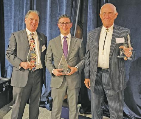 Clay S. Conrad, Wade B. Smith and Paul S. Looney receive their honors at the Harris County Criminal Lawyer’s Association banquet. CONTRIBUTED PHOTO