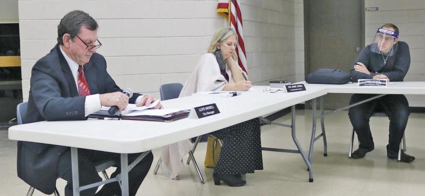 Former Sealy City Manager Lloyd Merrell, left, reads a statement during a special meeting of the city council Nov. 30, 2020, in which he asked them to let him do his job or else terminate his employment. Pictured next to him are council members Dee Anne Lerma and Chris Noack. FILE PHOTO